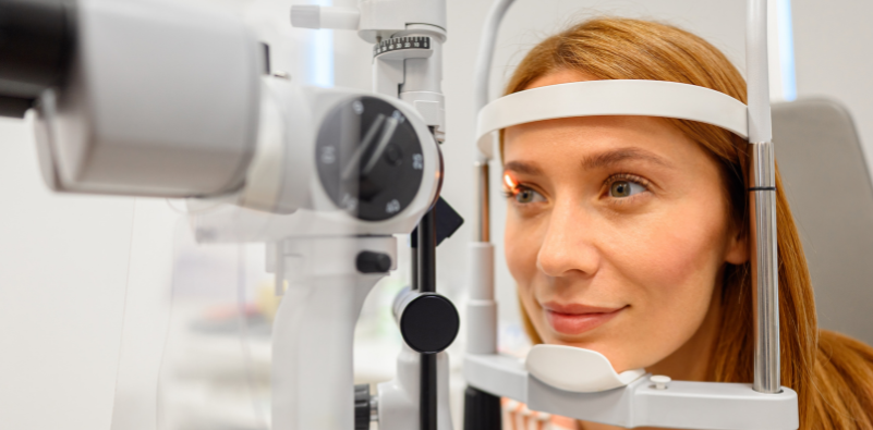 Woman having a slit-lamp eye examination with an eye care professional