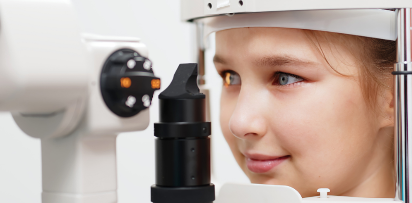 Child having an eye examination with an eye care professional.